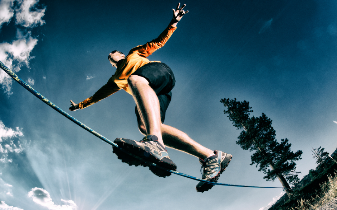 person balancing on rope