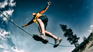 person balancing on rope